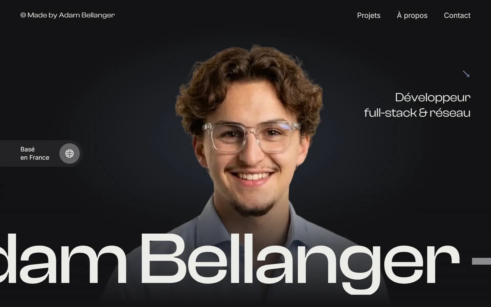 Portfolio home page: cut-out portrait and large scrolling name